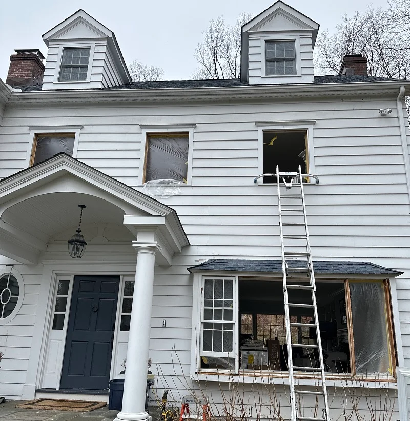 Window Solutions PLus removing old windows during a window installation in Wilton, CT